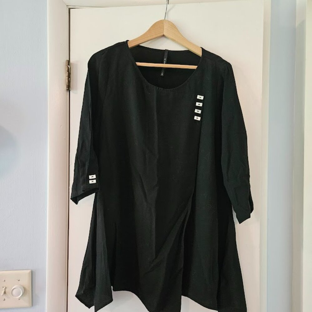 Black blouse with white shell buttons